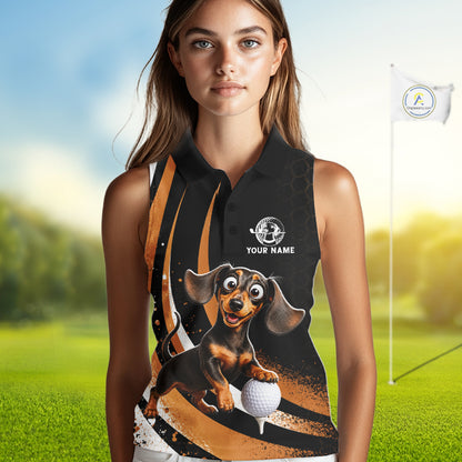 A woman modeling a sleeveless black polo-style top with a colorful printed graphic of a dachshund holding a golf ball, set against a blurred golf course background with a flagpole visible.