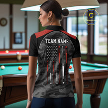 Load image into Gallery viewer, Back view of woman wearing a red camo American flag pool shirt in a billiards hall.
