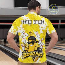 Load image into Gallery viewer, Back view of man wearing a funny yellow banana bowling quarter zip shirt in a bowling alley.
