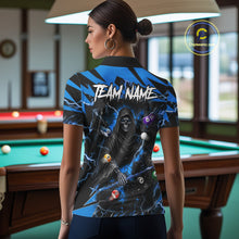 Load image into Gallery viewer, Back view of woman wearing a blue grim reaper lightning 8 ball pool shirt in a billiards hall.