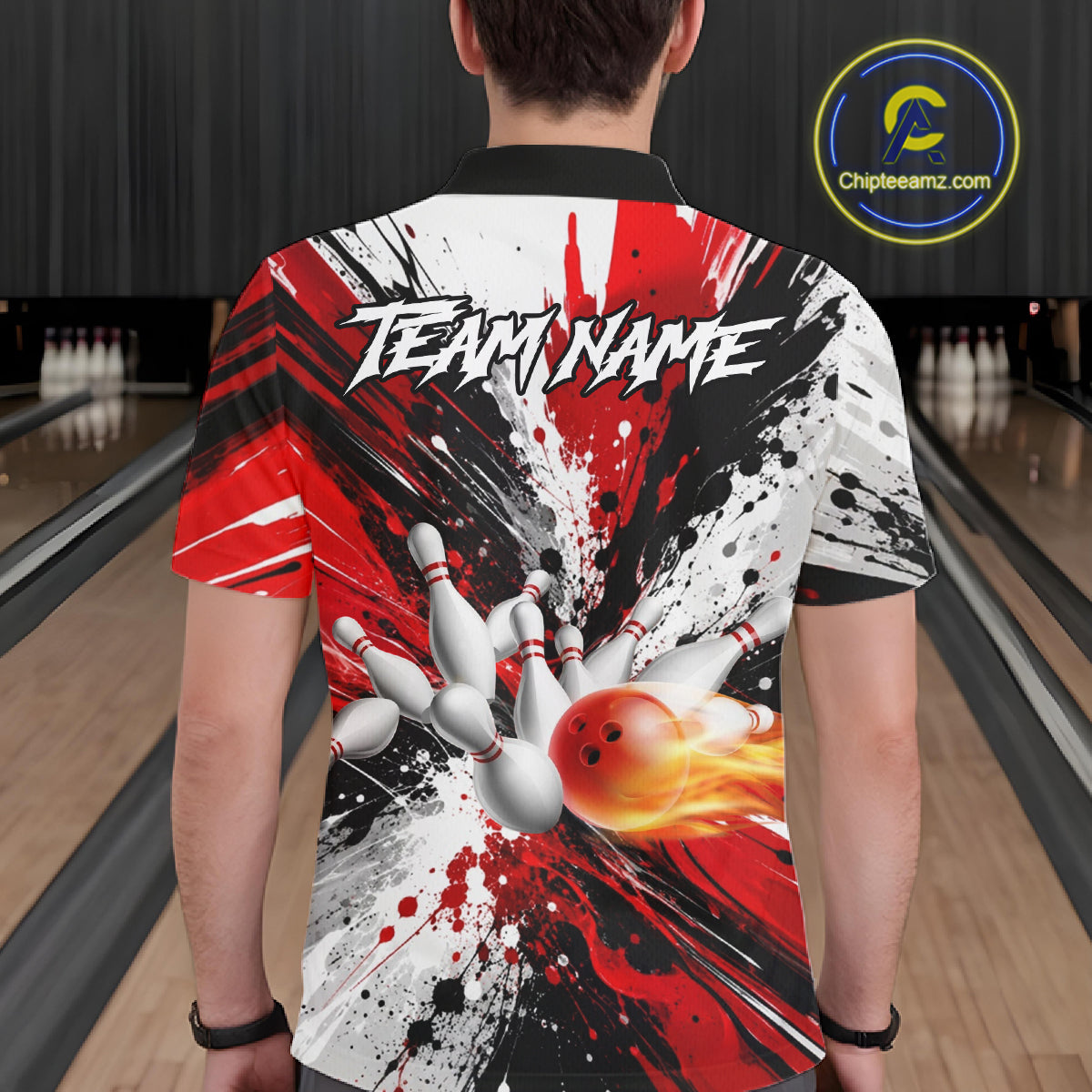 Back view of man wearing a red splatter bowling polo shirt inside a bowling alley.