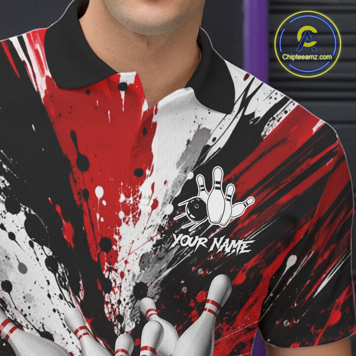 Close-up of a red splatter bowling polo shirt collar, buttons, and bowling ball design.