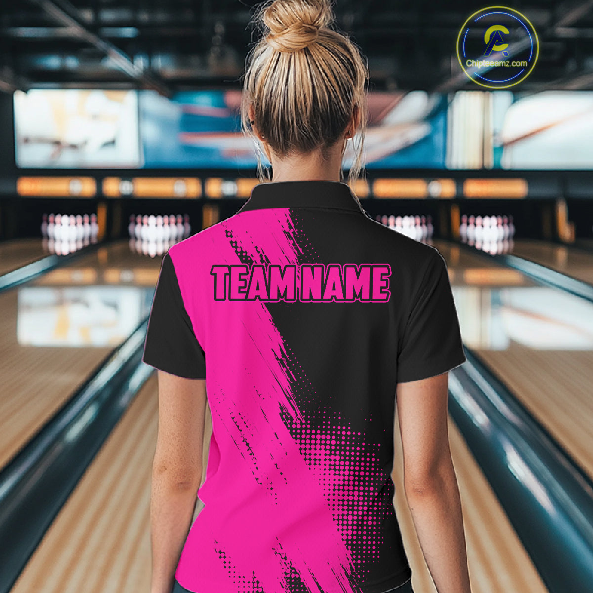 Female model wearing the Custom Pink and Black Strike Bowling polo shirt with vibrant pink and black bowling graphics, back view