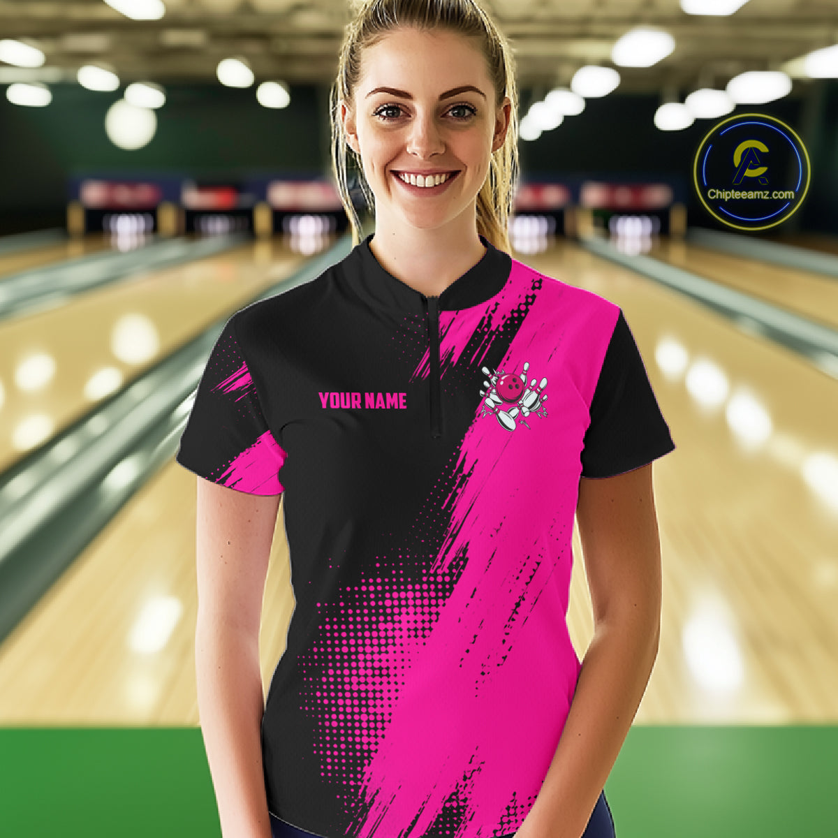 Female model wearing the Custom Pink and Black Strike Bowling quarter zip shirt featuring bold pink and black bowling artwork, front view