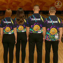 Load image into Gallery viewer, Back view of bowling team wearing matching sunflower bowling shirts in a bowling alley.