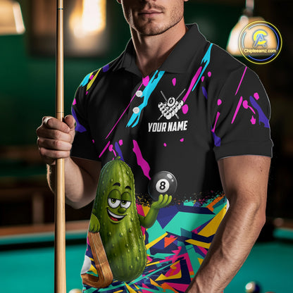 Man wearing a colorful pickle 8 ball billiard jersey beside a pool table front view.