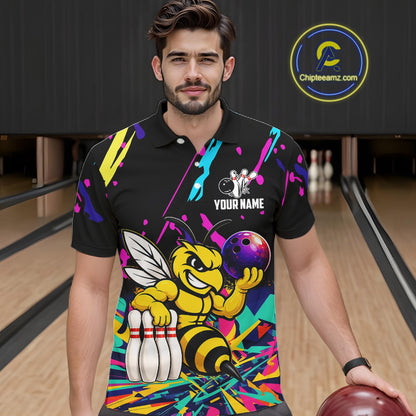 Man wearing a colorful bowling-themed shirt with a bee graphic in a bowling alley.