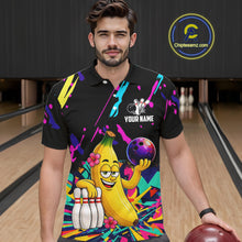 Load image into Gallery viewer, Man wearing a colorful bowling shirt with a cartoon banana character in a bowling alley.