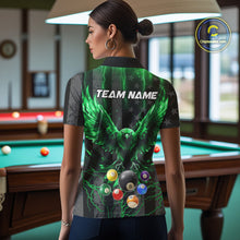 Load image into Gallery viewer, Back view of woman wearing a green lightning eagle pool shirt inside a billiards hall.