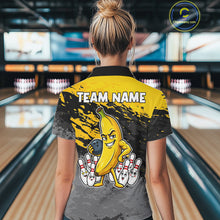 Load image into Gallery viewer, Back view of woman wearing a yellow funny banana bowling polo shirt inside a bowling alley.