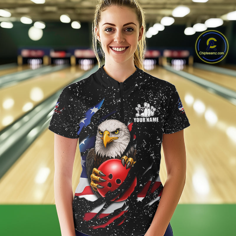 Woman wearing a black grunge American flag eagle bowling quarter zip jersey during tournament play front view.