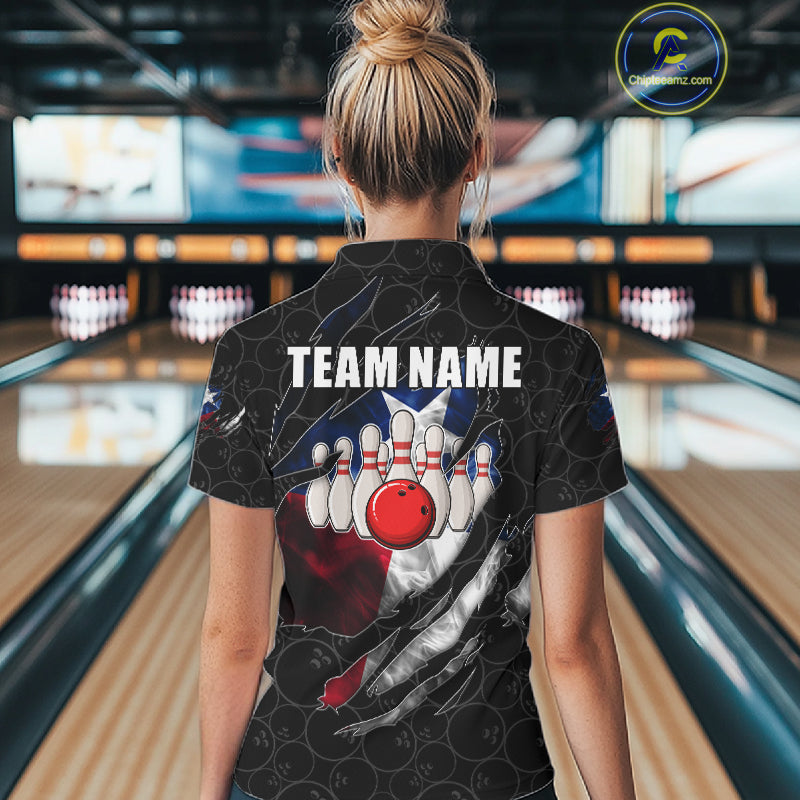 Back view of woman wearing a smoke Texas flag black bowling polo shirt inside a bowling alley.