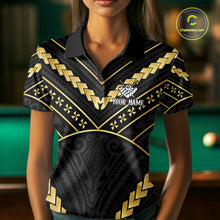 Load image into Gallery viewer, Woman wearing a black and gold 8 ball tribal billiard jersey beside a pool table front view.