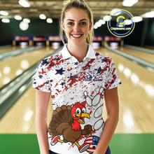 Load image into Gallery viewer, Woman wearing a colorful bowling-themed shirt with a turkey design in a bowling alley.